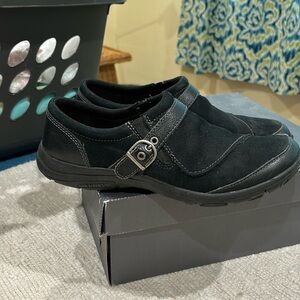 Black Merrill shoes, waterproof, soles with winter tread.Slip on easily Size 9